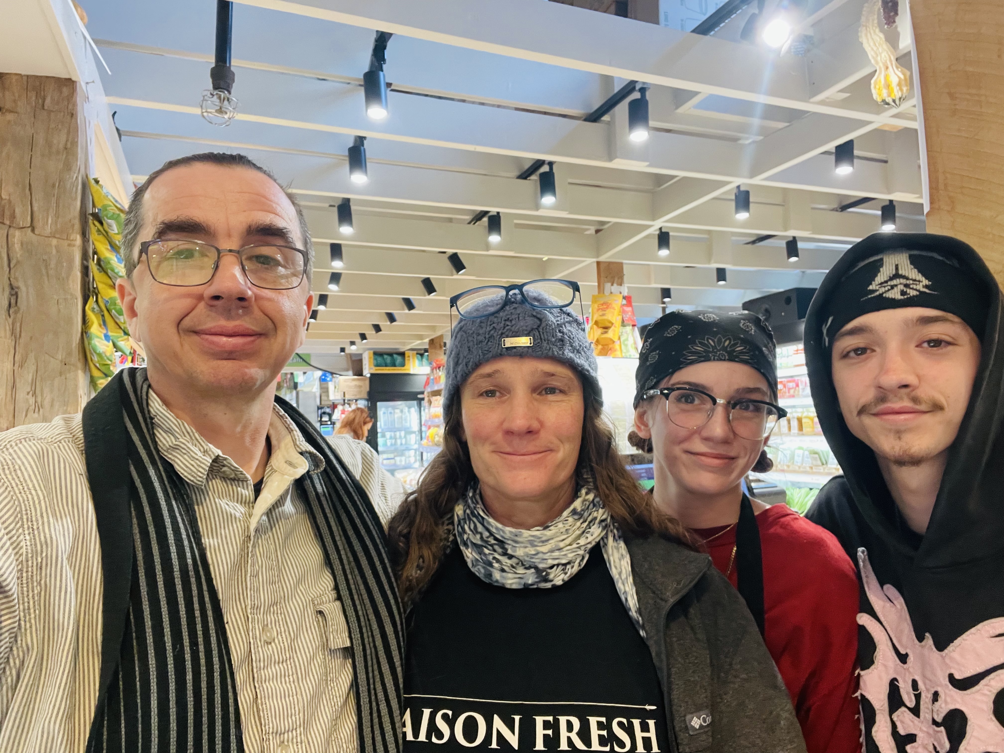 Four members of the Maison Fresh team together inside the market shop